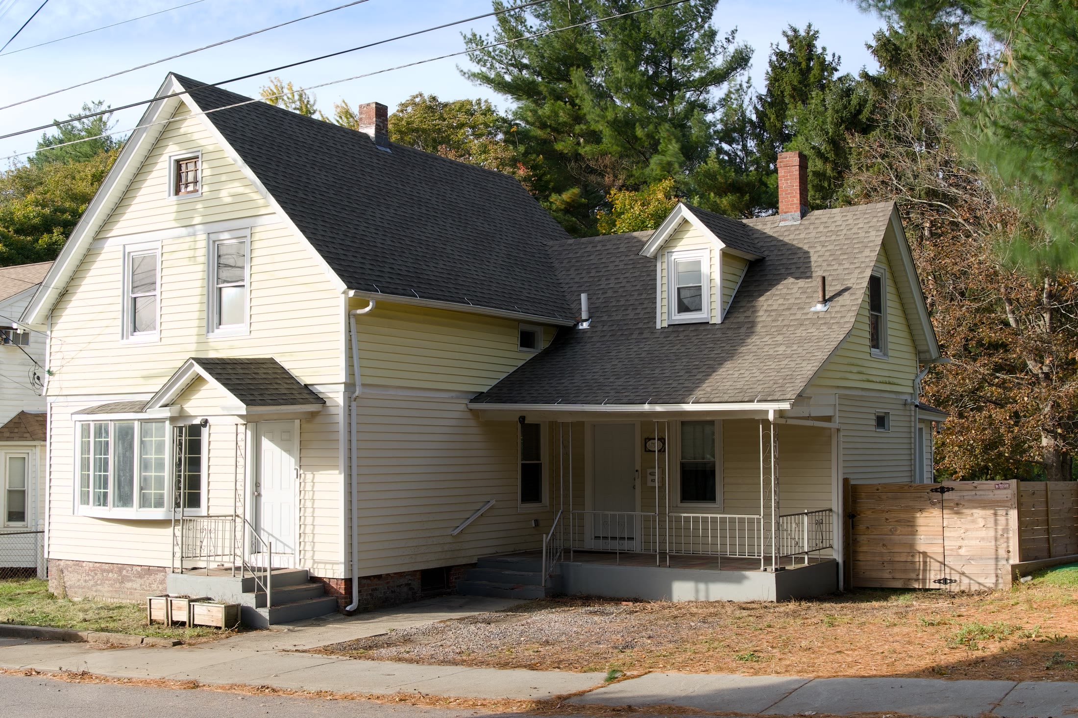 Front exterior of a two-story yellow home