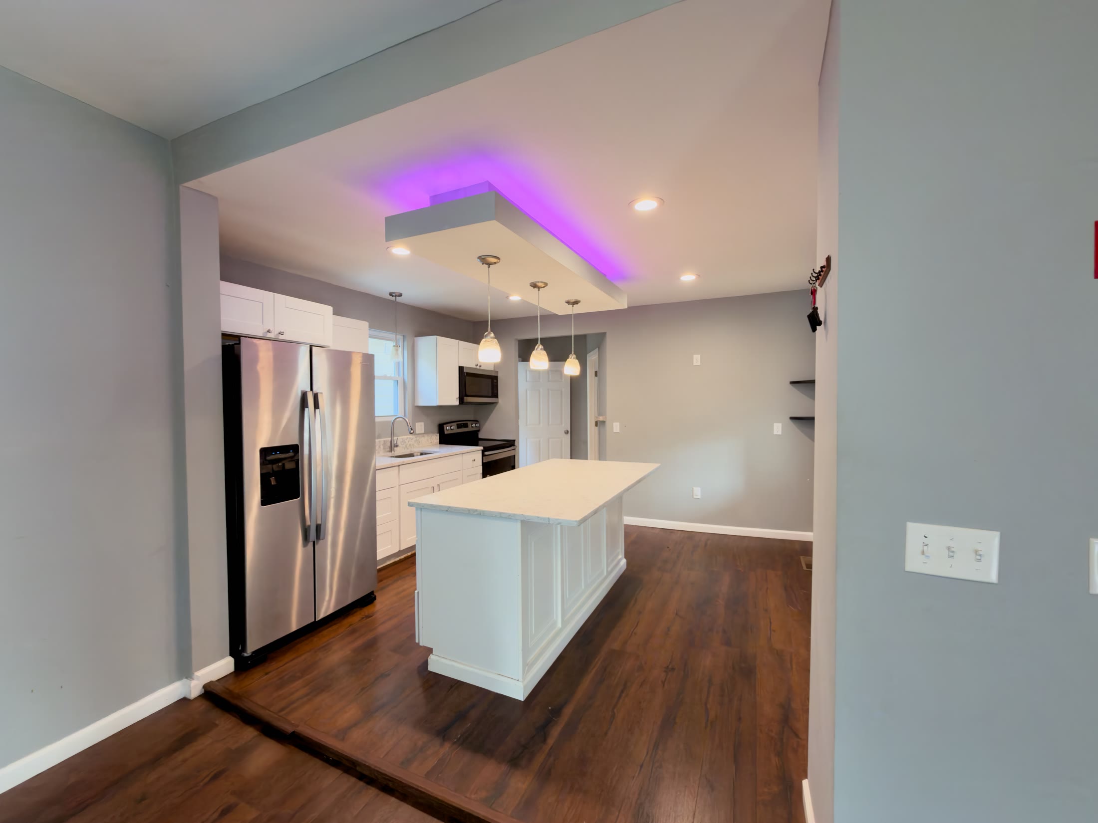 Kitchen with island and accent lighting