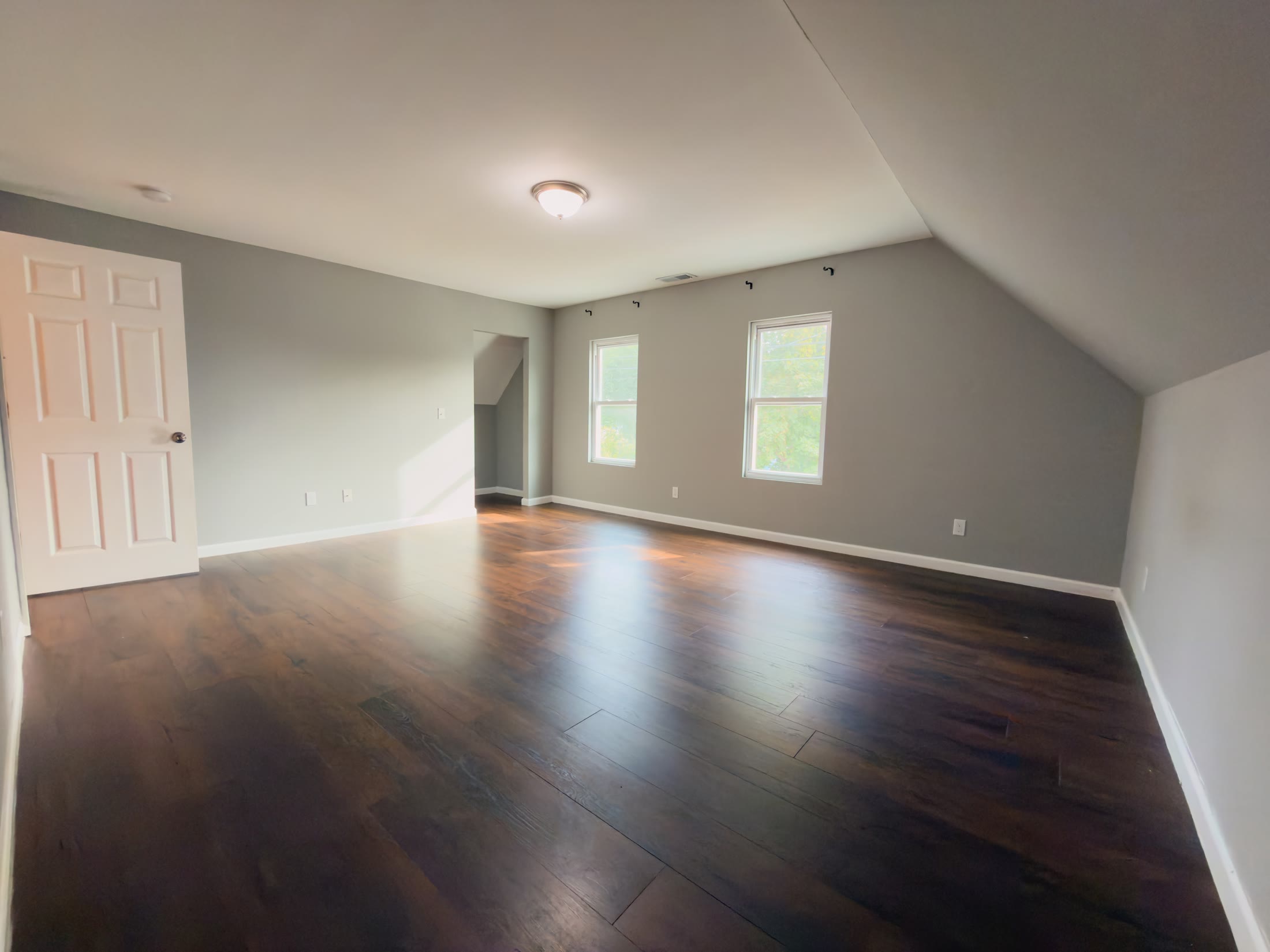 Upstairs bedroom with angled ceiling